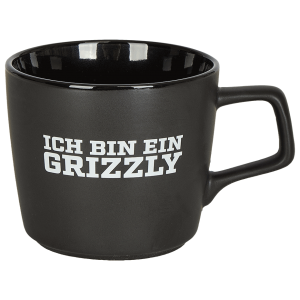 Das Foto zeigt eine schwarze Keramiktasse der Grizzlys Wolfsburg mit eingebranntem Logo.