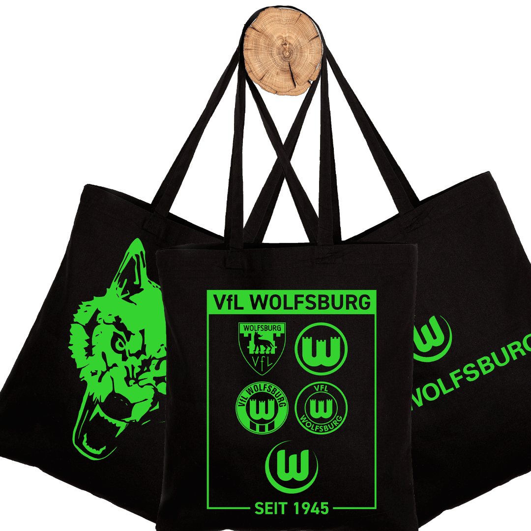 Das Foto zeigt eine schwarze Bio-Baumwolltasche vom VfL Wolfsburg mit drei verschiedenen Motiven.